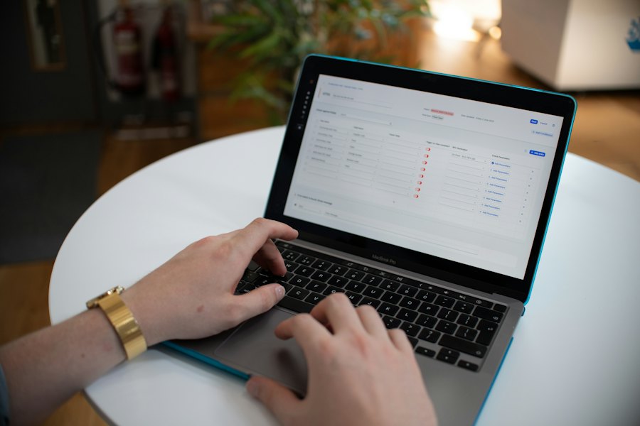 A person working on a laptop with a business application open
